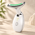 White neck and face massager with a curved chrome head and a green light strip.